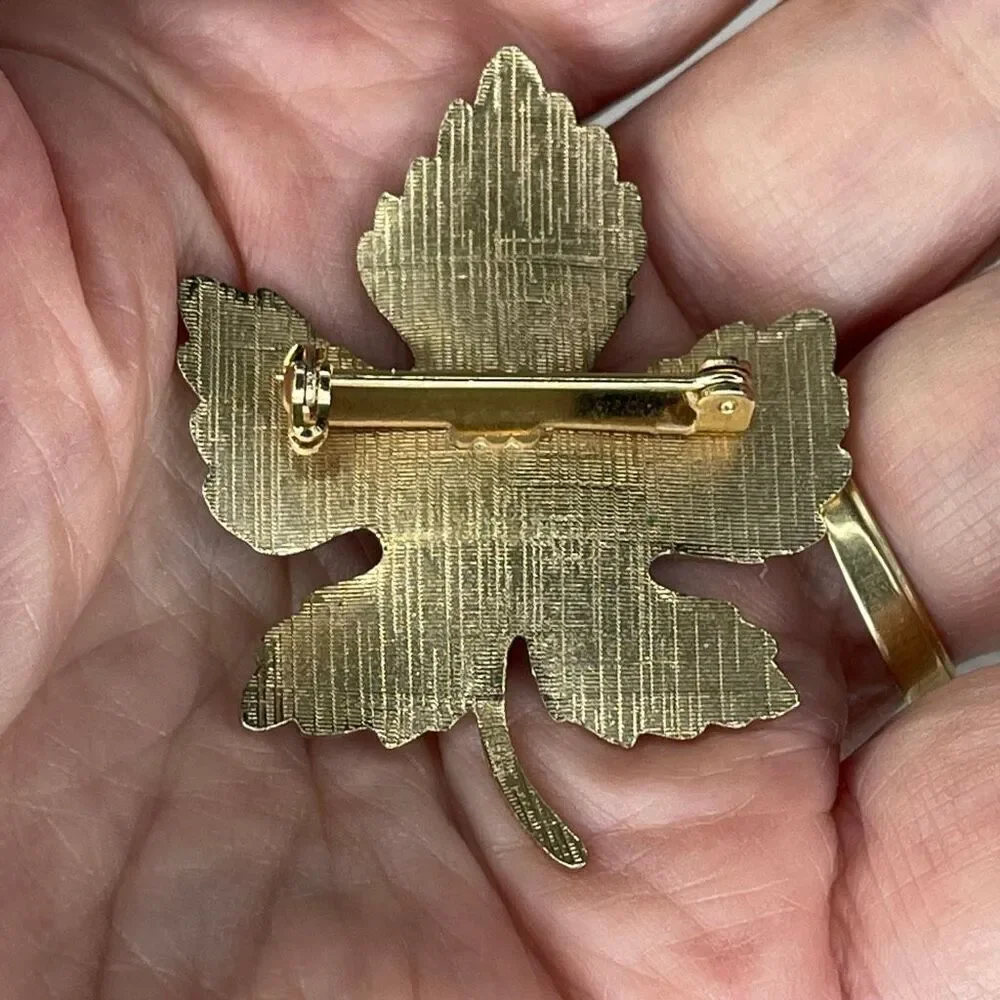 Vintage enamel maple leaf brooch.